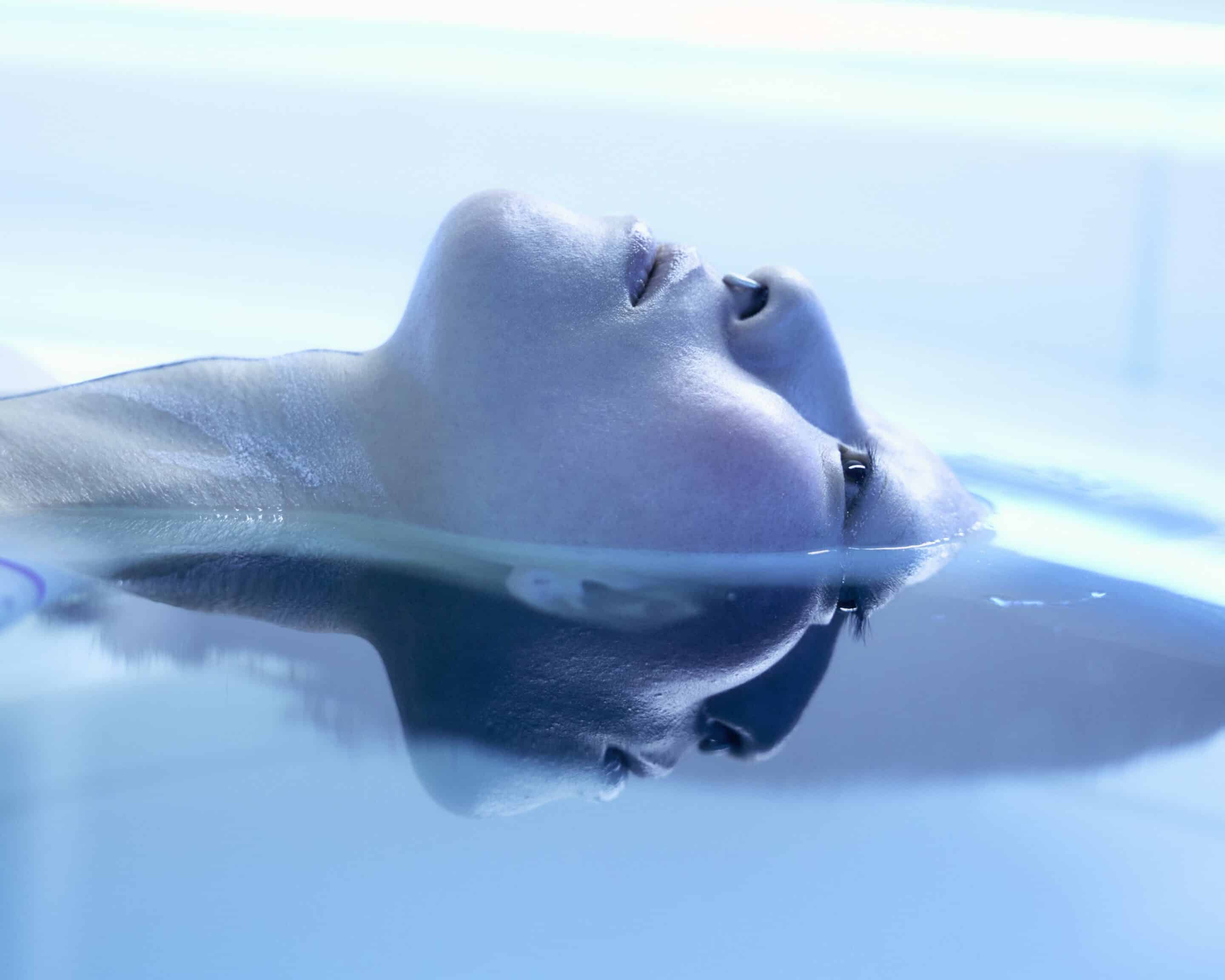 a room with a bed and a mirror